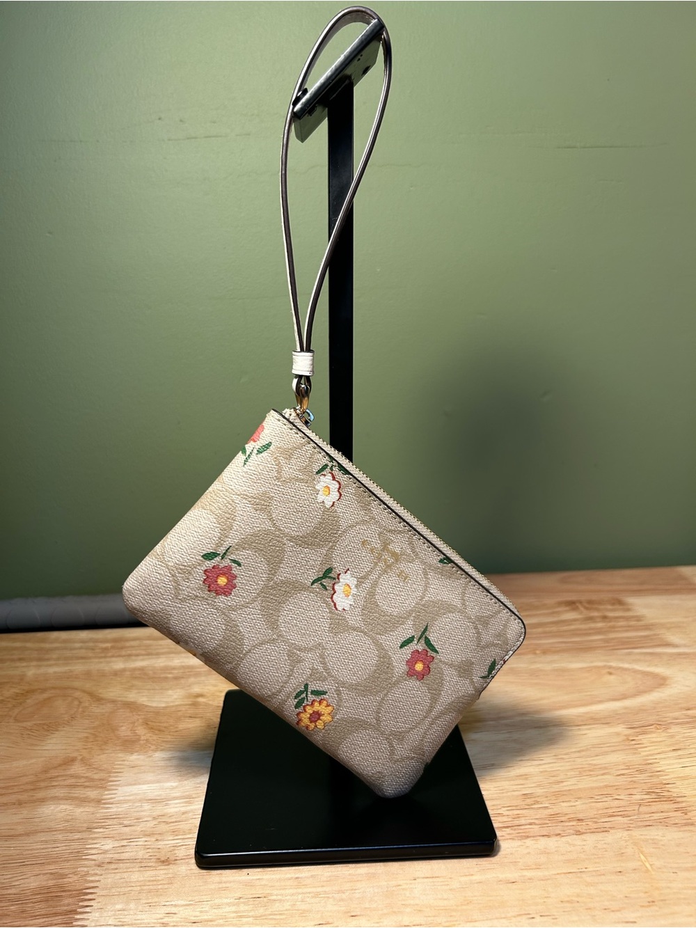 Coach logo floral mini wristlet